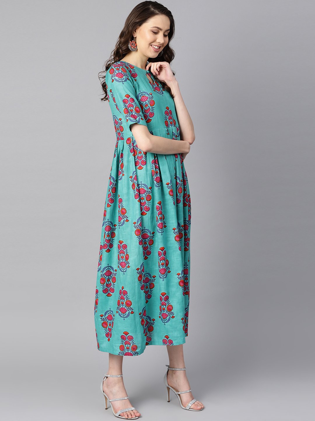 Women's Turqish Blue Color Printed Half Sleeve Pleated Maxi Dress With Deep Back And Tassel Detailing.